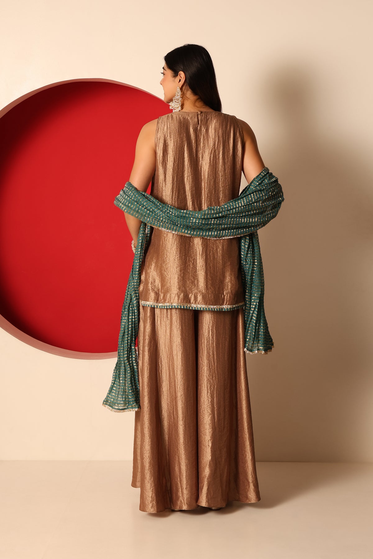 Riva- Gold Tissue short Kurta and Flaired pants paired with crush chanderi dupatta